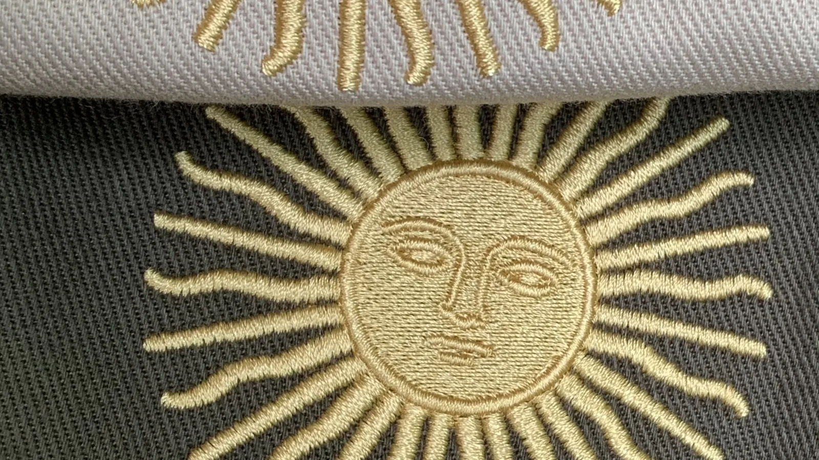 Sol de Mayo bordado en dorado sobre una bombacha de campo Autóctona